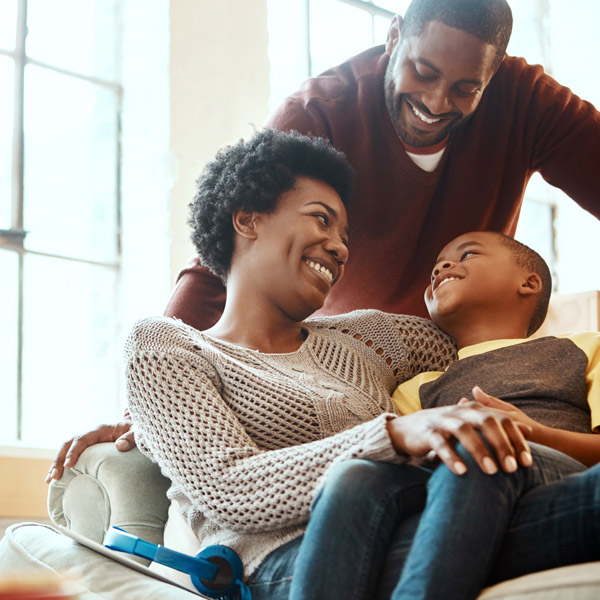 family of three smiling together